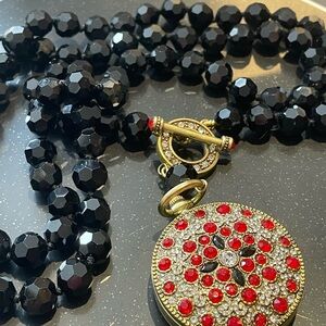 Elegant Black and Gold Necklace with Red Accents